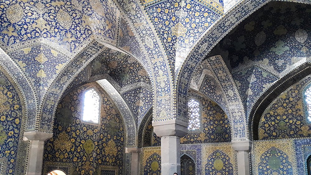 Isfahan travel guide featuring Shah Mosque with its magnificent blue tilework and Persian architecture in Naqsh-e Jahan Square