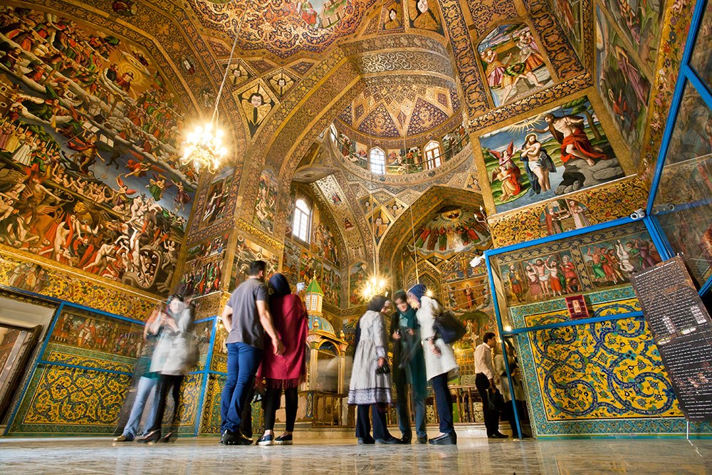 Isfahan travel guide featuring Vank Church with its beautiful Armenian architecture, historic murals, and golden interior in Jolfa district