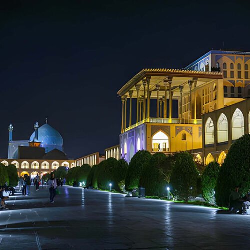 Ali Qapu Palace in Isfahan illuminated at night, showcasing Safavid architecture in Naqsh-e Jahan Square
