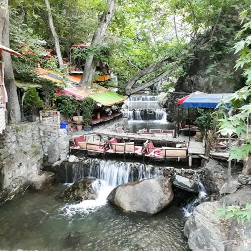 15 Days Iran Tour exploring Darband Tehran, a scenic mountain village with restaurants and hiking trails