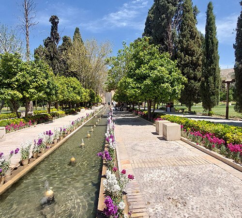 Beautiful Persian gardens in Shiraz featuring lush greenery, flowing water, and traditional architecture