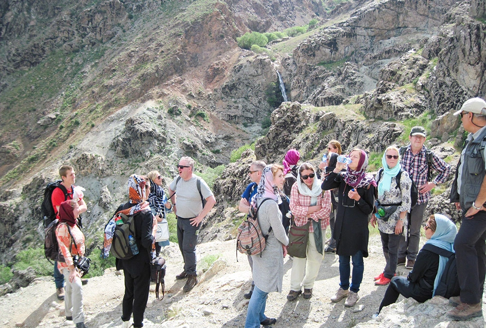 Experienced tour guide introducing travelers to Iran's history and culture